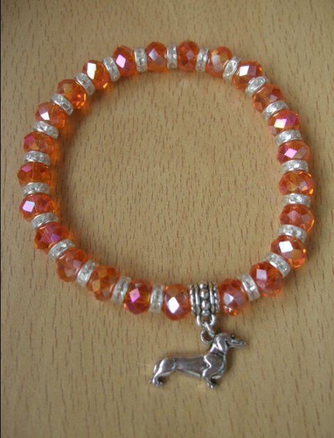 glasarmbnd, orange m/gravhund